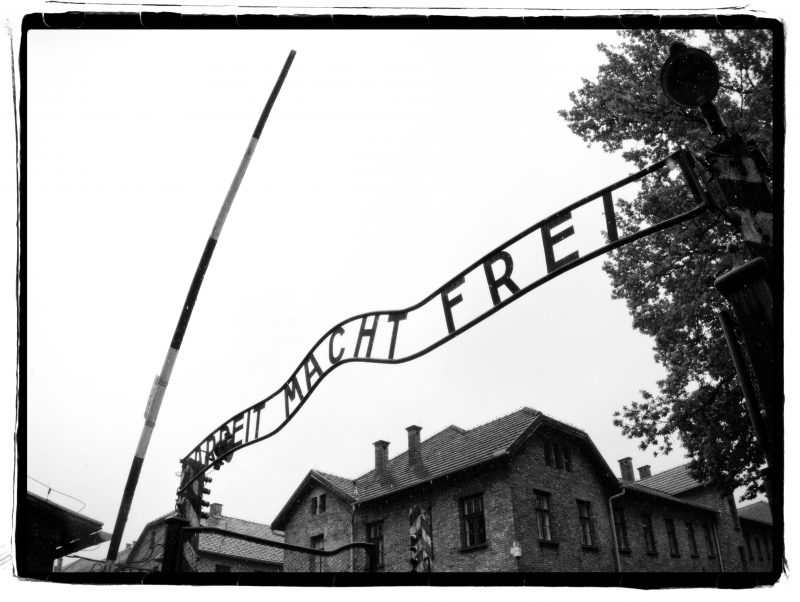 Black and white photo: Gate to death camp
